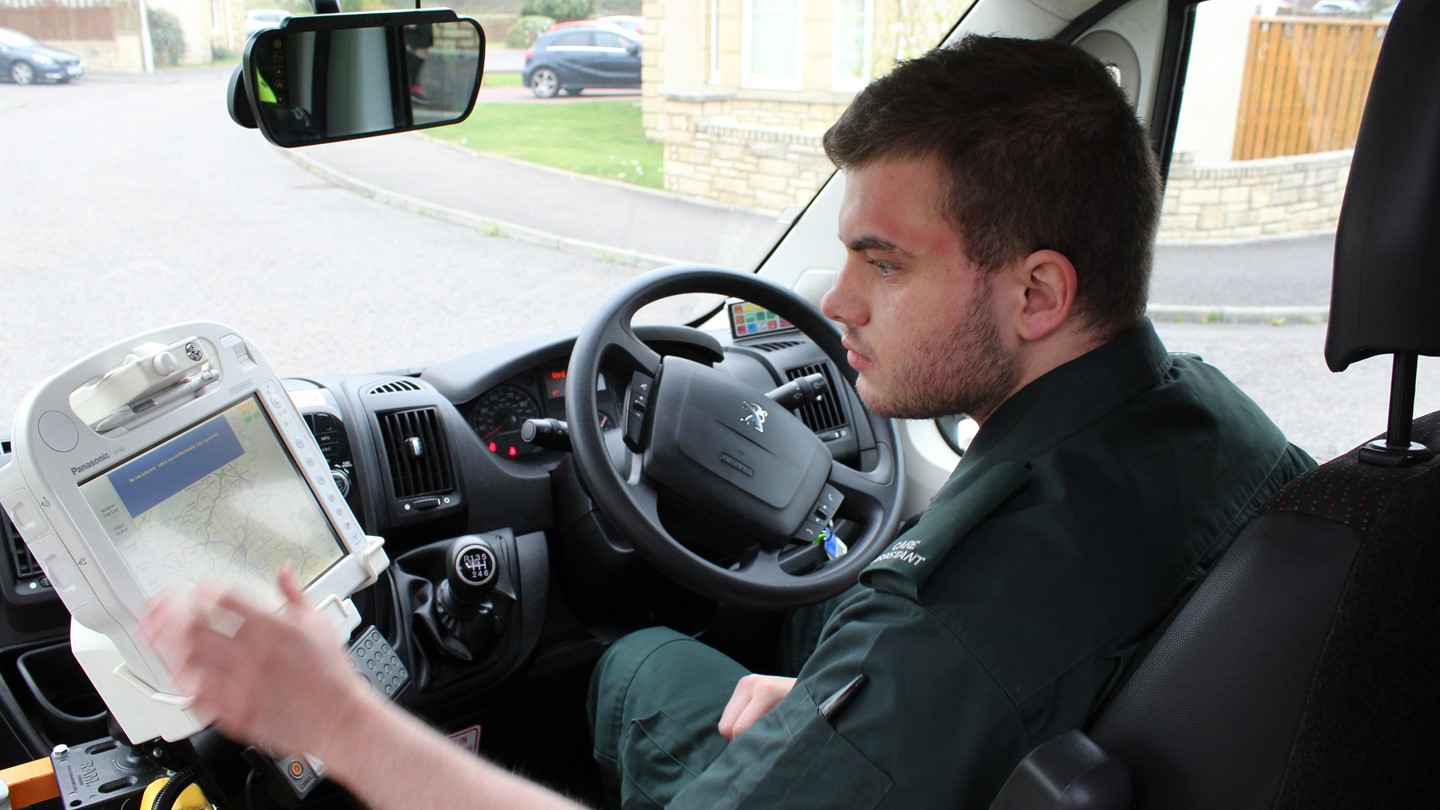 An Ambulance Care Assistant in his ambulance