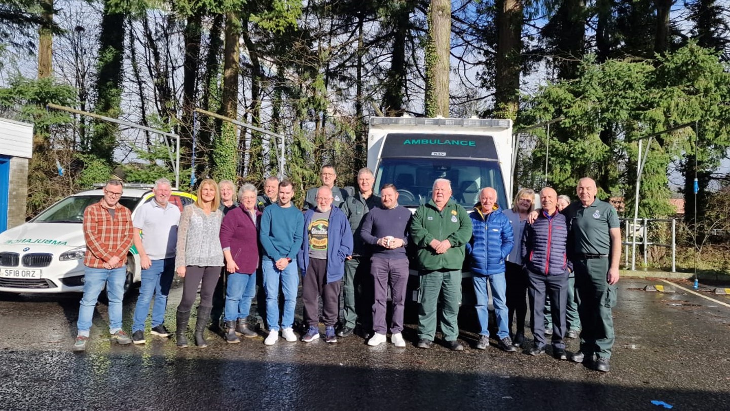 Group shot of Andrew with other staff