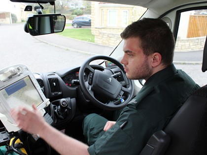 An Ambulance Care Assistant in his ambulance