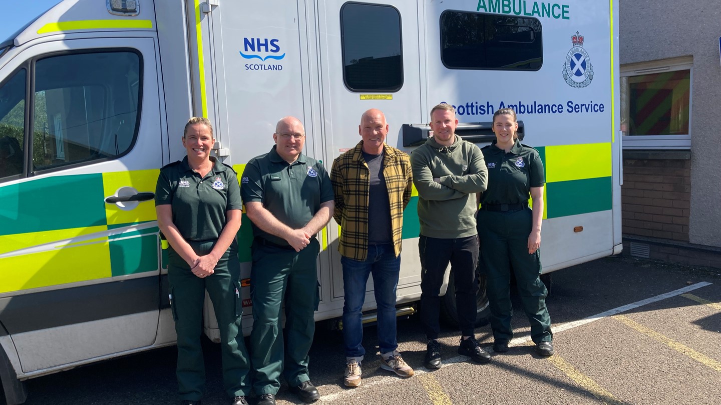 Patient Mal Adams with SAS staff in Dundee