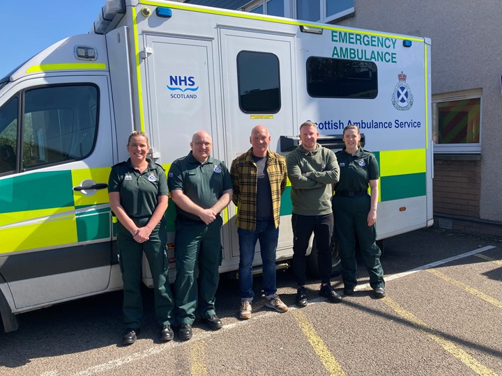 Patient Mal Adams with SAS staff in Dundee