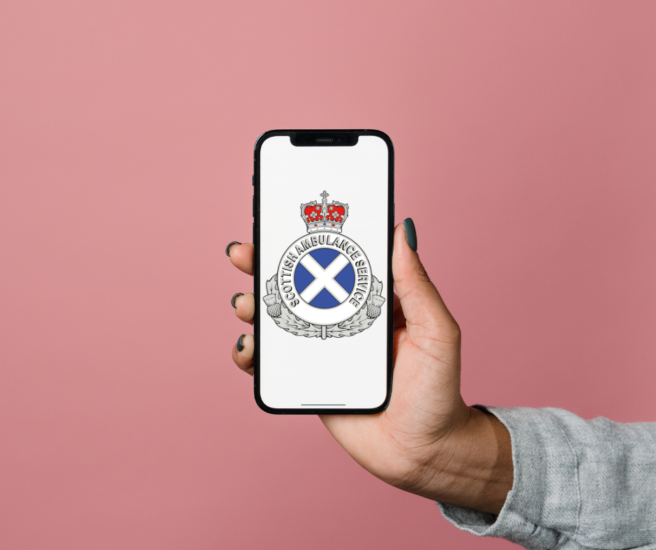 Hand holding a mobile phone with the SAS logo on the screen.