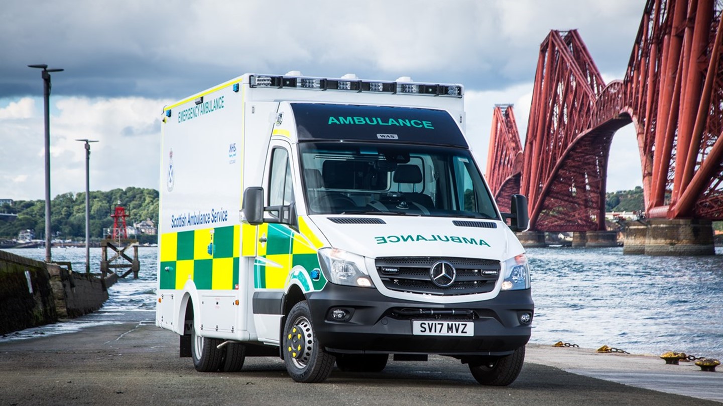 An A&E ambulance in front of the Forth Railway Bridge