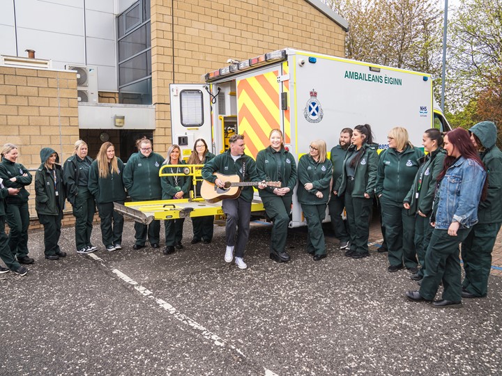 Callum singing a song to staff outside