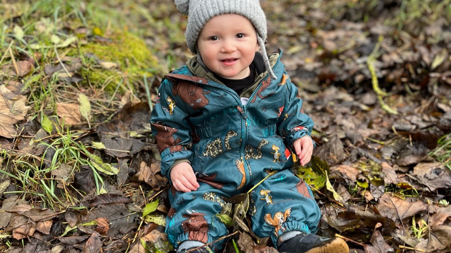 Picture of Jackson Taylor sitting in leaves