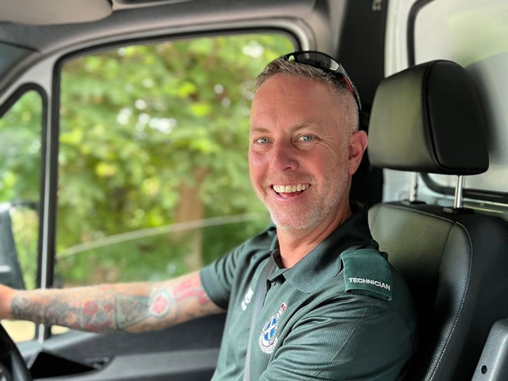 Iain driving an ambulance