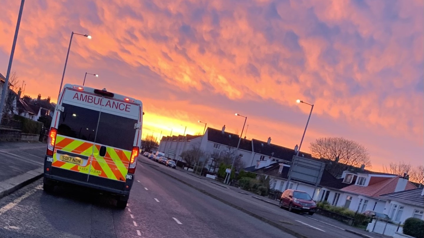 Picture of Scheduled Care vehicle with a sunset in background