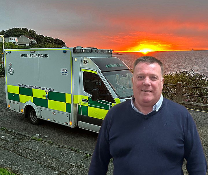 Stevie Gilroy in front of an ambulance at sunset
