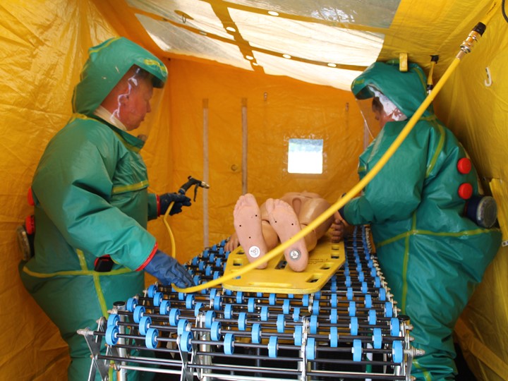 SORT staff members in HAZMAT suits doing an exercise