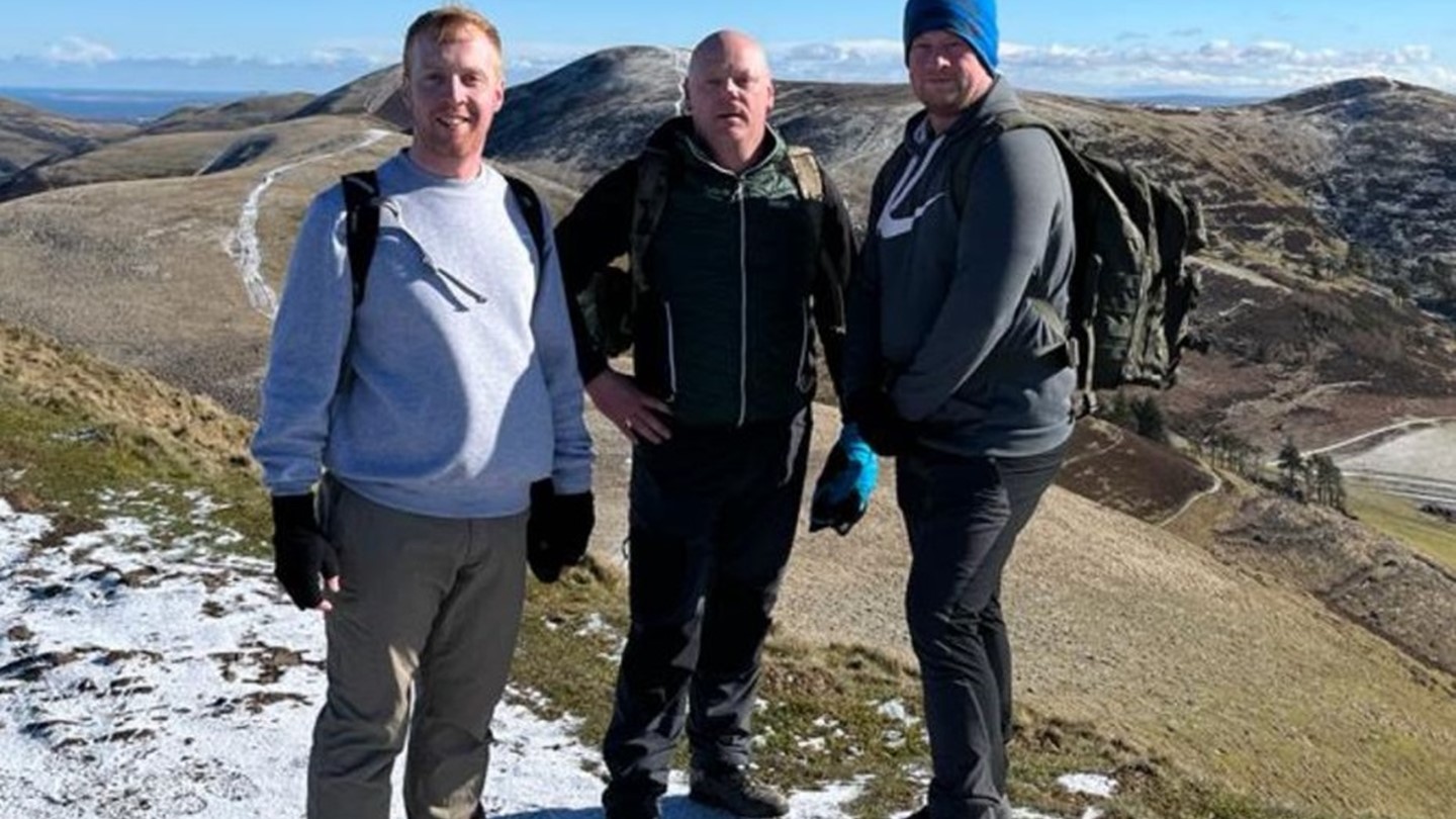 Pictured are Iain, Graeme, and Nick at the top of the Pentlands