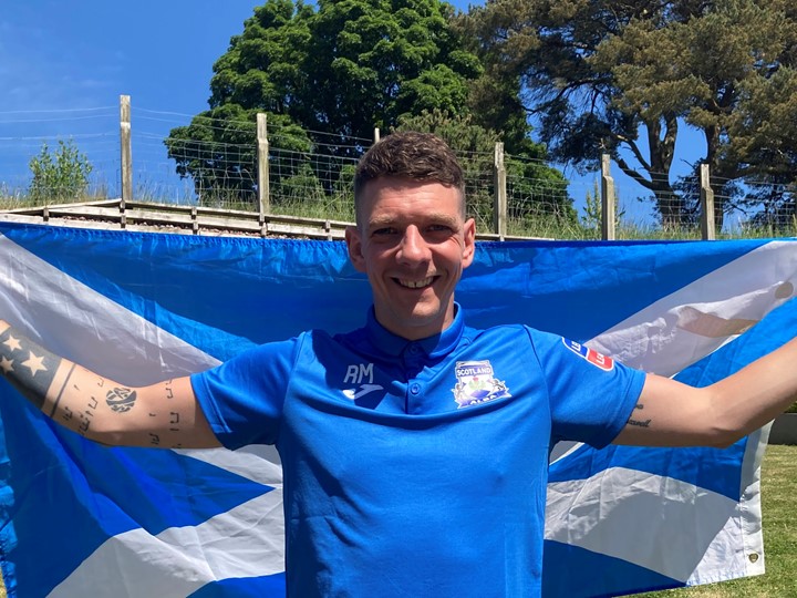 Ritchie in Scotland match outfit and flag