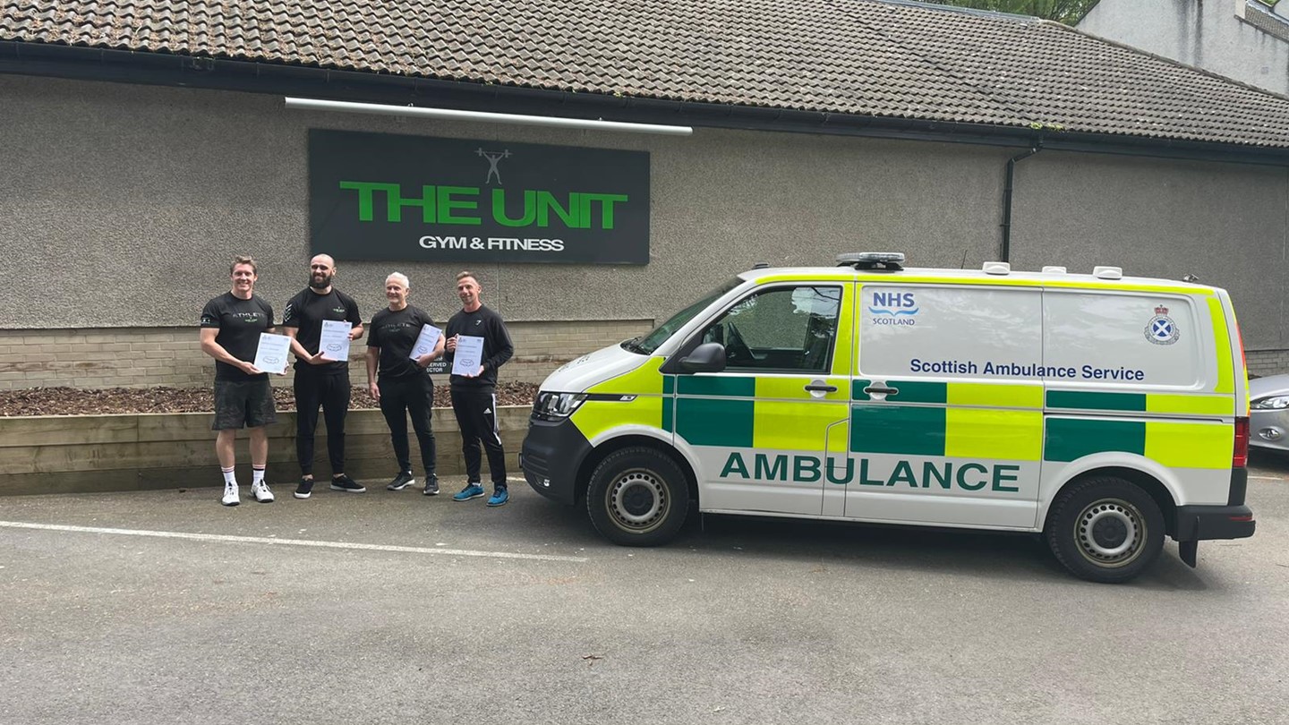 Gym staff with their certificates