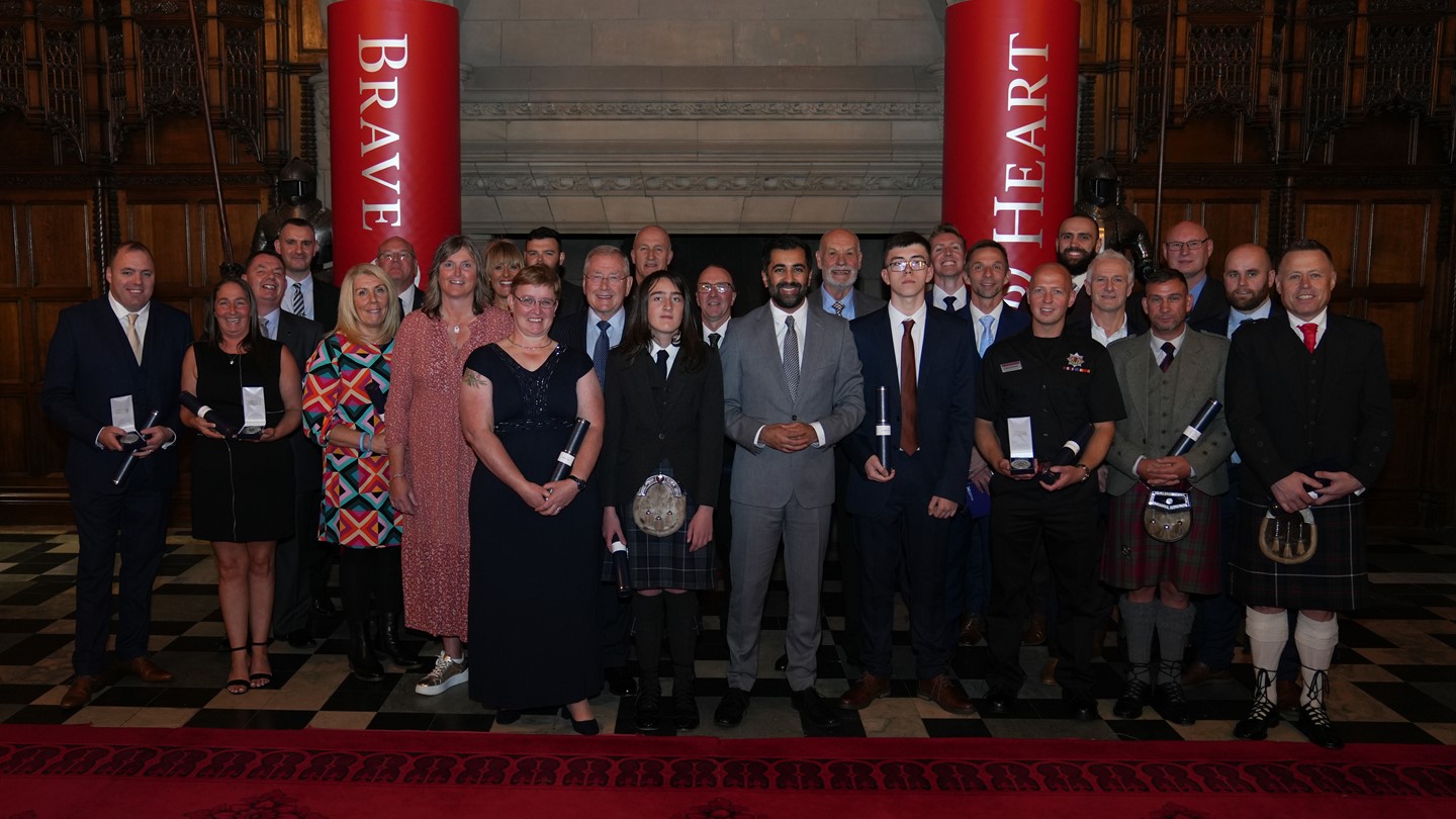 Group photo of attendees at the Brave@Heart awards including Hamza Yousef