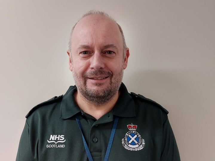 Kenny in SAS uniform smiling at news he received award