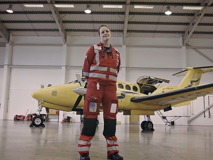 Yvonne Gibson in front of a King Air