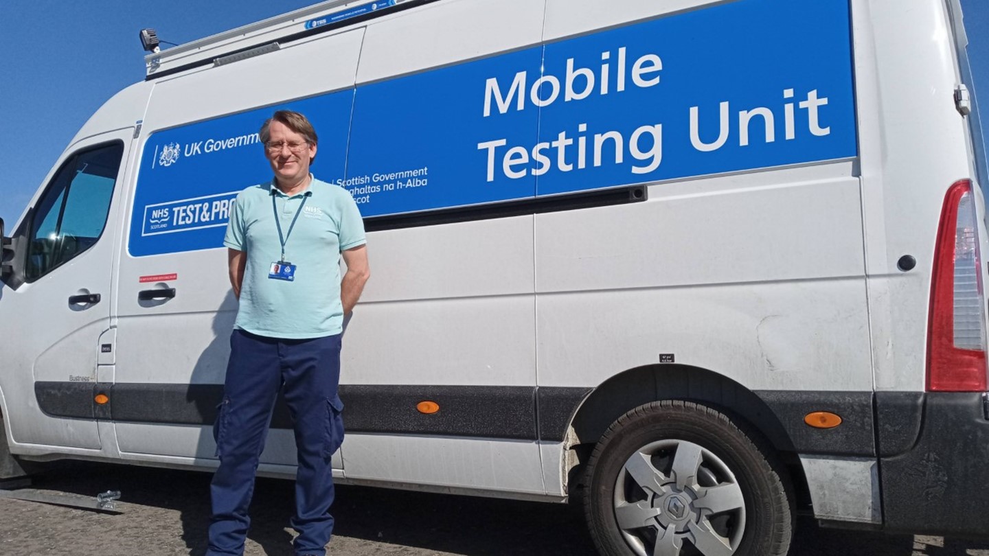 Marcus Spinks in front of a mobile testing unit van