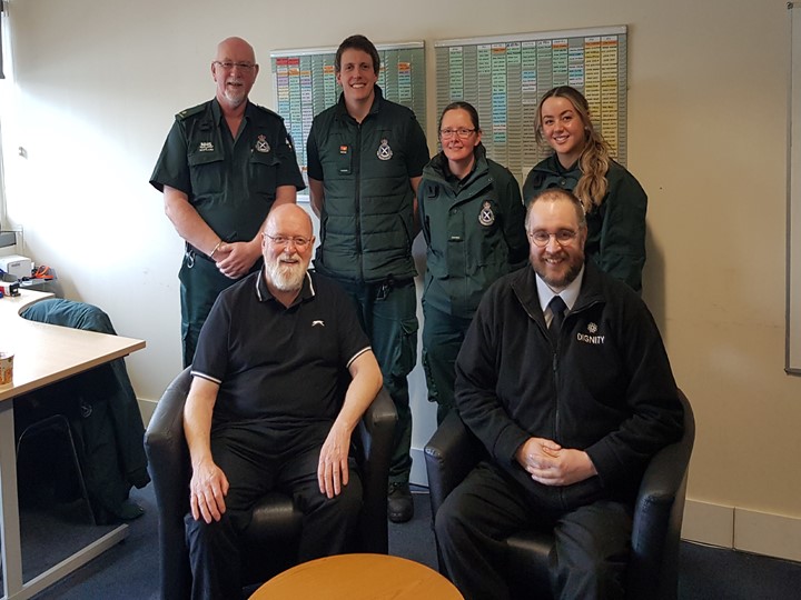 Gerry and Chris sit in front of the Ambulance crew