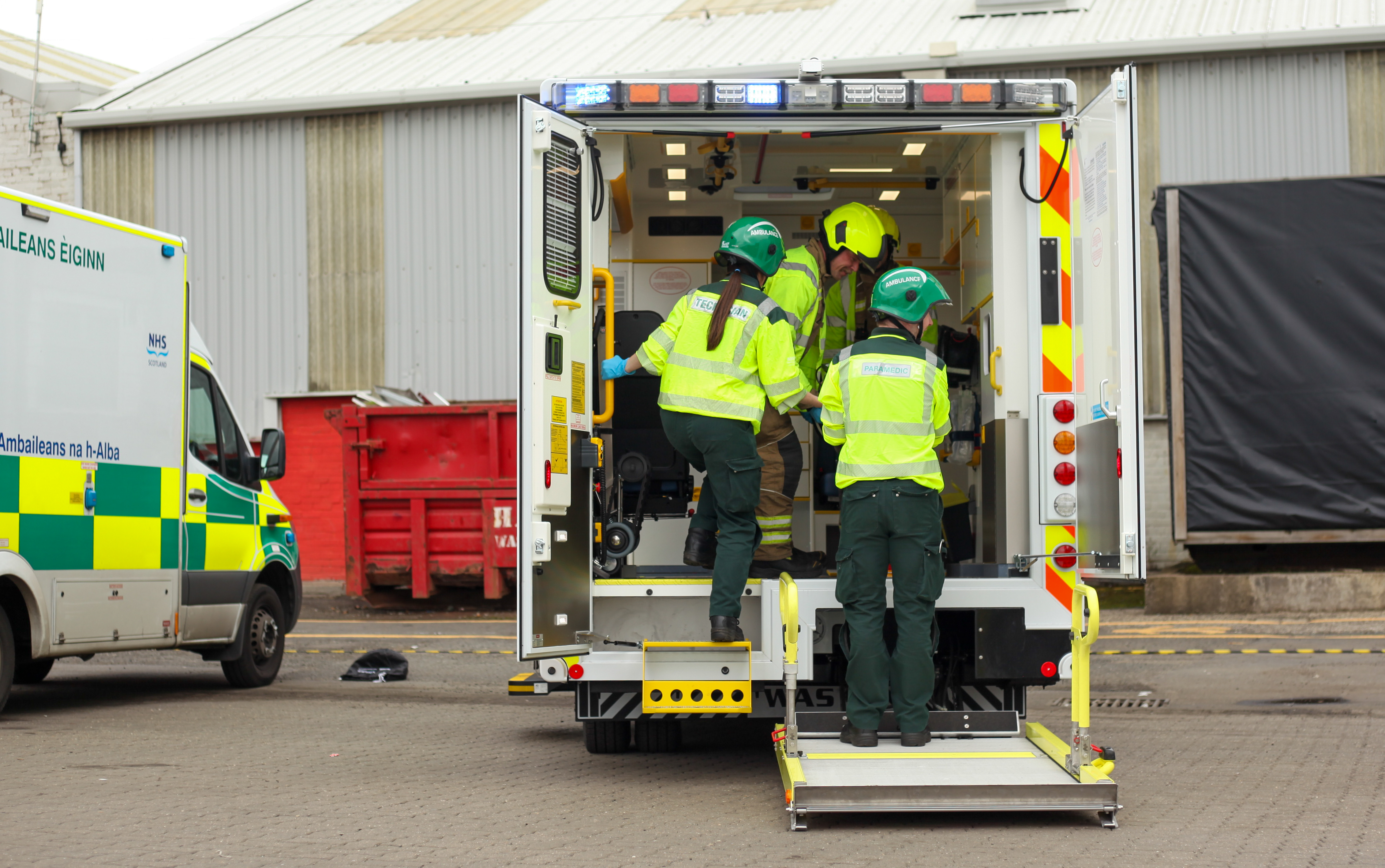 Staff unload patient out of ambulance during mock exercise